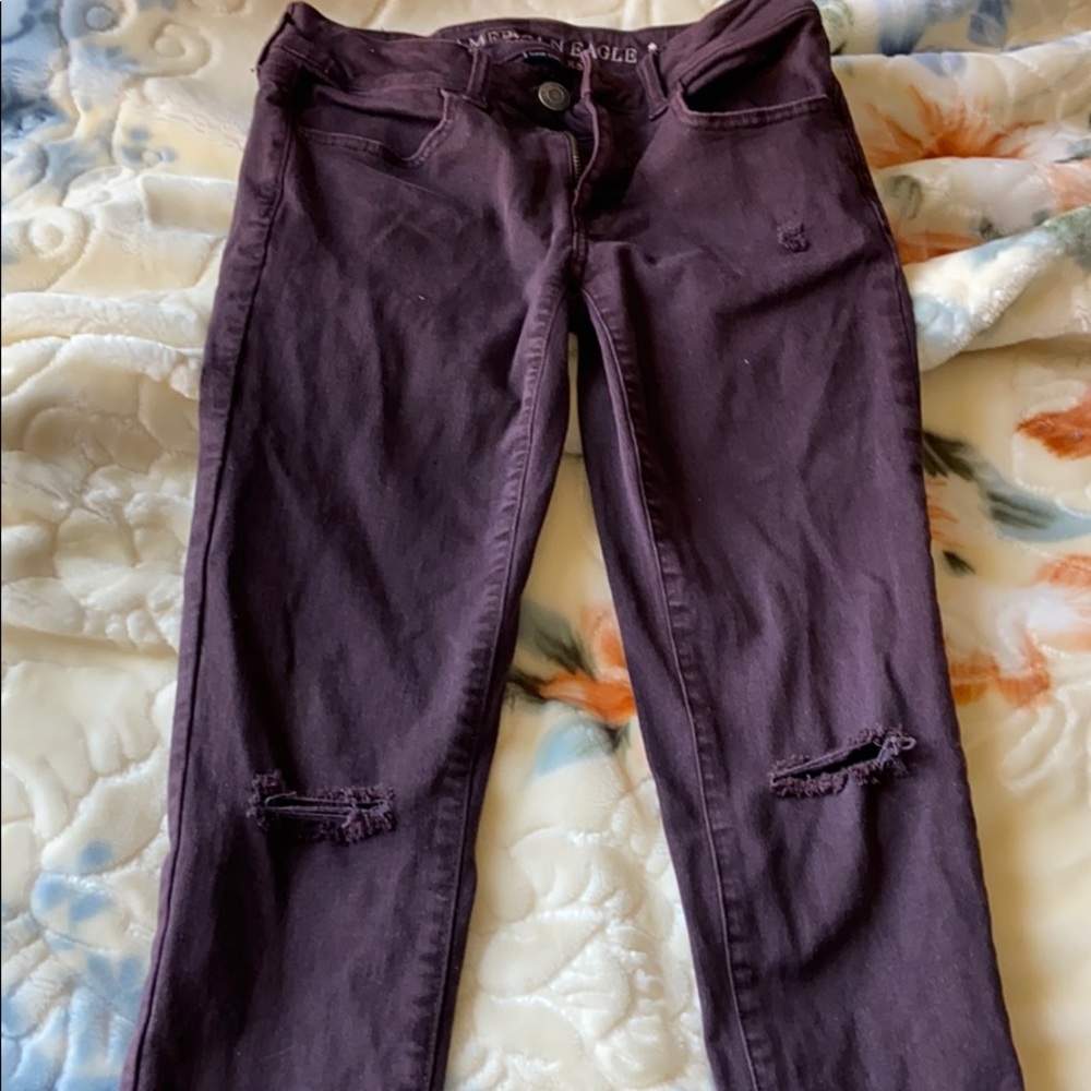 Ripped maroon skinny jeans